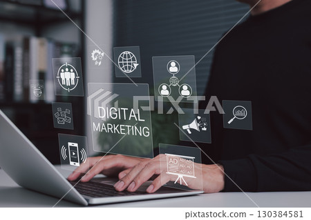 Digital marketing and online advertising concept. Person working on laptop with icons for marketing, social media, online advertising, content strategy, user targeting, and performance analytics. Digital marketing and online advertising concept. Person working on laptop with icons for marketing, social media, online advertising, content strategy, user targeting, and performance analytics. 130384581