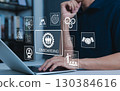 Onboarding New Employee Process Concept. Person working on laptop with icons representing the onboarding process, human resources, training, employee integration, hiring, and corporate orientation. 130384616