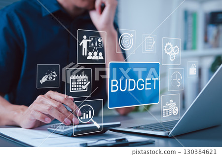 Budget and Financial Planning Concept. Businessman using calculator and laptop with icons representing budgeting, financial management, planning, annual expenses, personal budget, economic strategy, Budget and Financial Planning Concept. Businessman using calculator and laptop with icons representing budgeting, financial management, planning, annual expenses, personal budget, economic strategy, 130384621