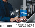 Leasing and Financial Service Concept. Businessman using laptop with icons related to leasing, finance, housing, automotive, interest rates, and monthly payments. lease agreement, leasing car, 130384624
