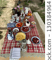 A table with a red and white checkered tablecloth 130384964
