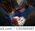 Surgeons and medical professionals working diligently in an operating room, performing a delicate surgical procedure on a newborn, highlight the critical care in neonatal medicine 130384985