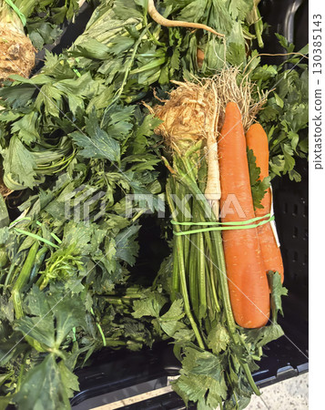 Freshly harvested carrots and celery roots ready for market at local farm Freshly harvested carrots and celery roots ready for market at local farm 130385143