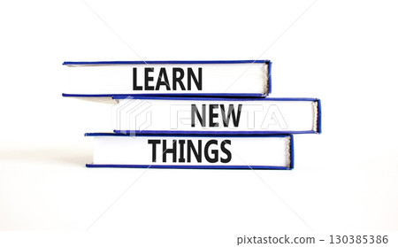 Learn new things symbol. Concept words Learn new things on beautiful blue white books. Beautiful white background. Business motivational learn new things concept. Copy space. Learn new things symbol. Concept words Learn new things on beautiful blue white books. Beautiful white background. Business motivational learn new things concept. Copy space. 130385386