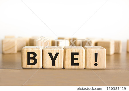 Bye symbol. Concept word Bye on beautiful wooden blocks. Beautiful wooden table white background. Business and bye concept. Copy space. Bye symbol. Concept word Bye on beautiful wooden blocks. Beautiful wooden table white background. Business and bye concept. Copy space. 130385419