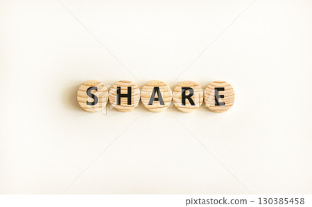 Share symbol. Concept word Share on beautiful wooden circles. Beautiful white table white background. Business lifestyle share concept. Copy space. 130385458