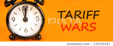 Trade tariff wars symbol. Concept word Tariff wars on beautiful orange paper. Beautiful black alarm clock. Beautiful orange paper background. Business trade tariff wars concept. Copy space. Trade tariff wars symbol. Concept word Tariff wars on beautiful orange paper. Beautiful black alarm clock. Beautiful orange paper background. Business trade tariff wars concept. Copy space. 130385491
