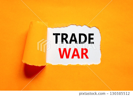 Trade war symbol. Concept word Trade war on beautiful white paper. Beautiful orange paper background. Business trade war concept. Copy space. Trade war symbol. Concept word Trade war on beautiful white paper. Beautiful orange paper background. Business trade war concept. Copy space. 130385512