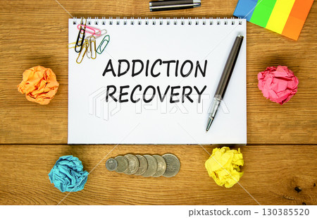 Addiction recovery symbol. Concept words Addiction recovery on beautiful white note. Beautiful wooden table wooden background. Black pen. Psychology addiction recovery concept. Copy space. Addiction recovery symbol. Concept words Addiction recovery on beautiful white note. Beautiful wooden table wooden background. Black pen. Psychology addiction recovery concept. Copy space. 130385520