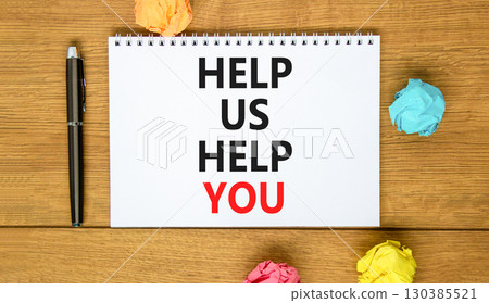 Help you symbol. Concept words phrase Help us help you on beautiful white note. Colored paper. Beautiful wooden background. Business Help you concept. Copy space. 130385521