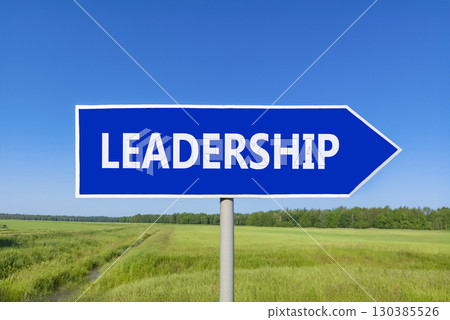 Leadership symbol. Concept word Leadership on beautiful blue road sign. Beautiful blue sky green grass and forest peaceful nature background. Business leadership concept. Copy space. 130385526