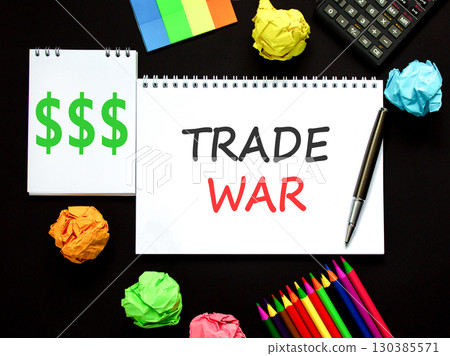 Trade war symbol. Concept word Trade war on beautiful white note. Black calculator. Black pen. Beautiful black paper background. Business trade war concept. Copy space. Trade war symbol. Concept word Trade war on beautiful white note. Black calculator. Black pen. Beautiful black paper background. Business trade war concept. Copy space. 130385571