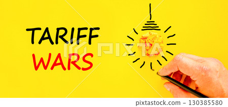 Trade tariff wars symbol. Concept word Tariff wars on beautiful yellow paper. Businessman's hand. Light bulb icon. Beautiful yellow paper background. Business trade tariff wars concept. Copy space. 130385580