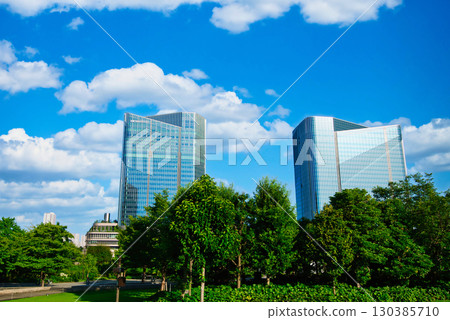Skyscrapers around Takanawa Gateway Station with beautiful fluffy clouds 130385710