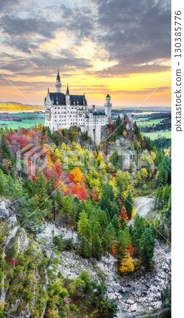 Amazing autumn view of famous Neuschwanstein Castle at sunset. 130385776