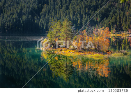 Amazing autumn  landscape of islands with pine-trees in the middle of Eibsee lake. 130385786