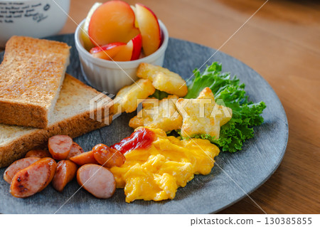 Breakfast plate with toast and scrambled eggs Breakfast plate with toast and scrambled eggs 130385855