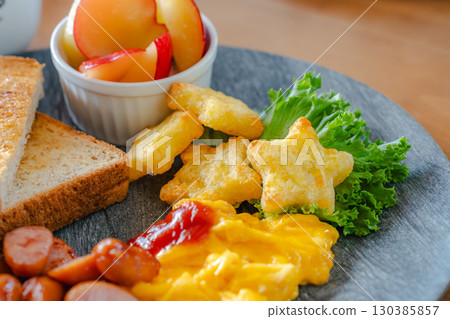 Breakfast plate with toast and scrambled eggs Breakfast plate with toast and scrambled eggs 130385857