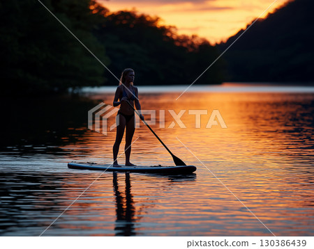 Illustration of a woman doing SUP on a lake 130386439