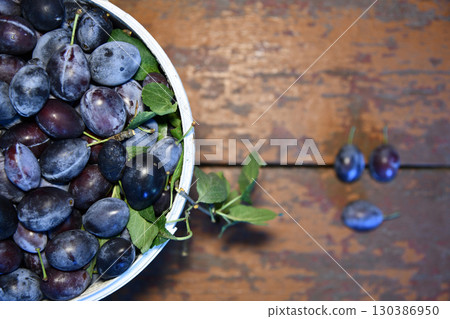Bucket filled with ripe, delicious plums , plum, fruit, bucket, ripe, juicy, fresh, sweet, organic, harvest, food 130386950