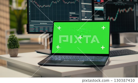 Close up of mockup laptop in forex trading firm office used for stock exchange analysis and strategy planning. Green screen notebook displaying stock market graphs in hedge fund company workplace Close up of mockup laptop in forex trading firm office used for stock exchange analysis and strategy planning. Green screen notebook displaying stock market graphs in hedge fund company workplace 130387410