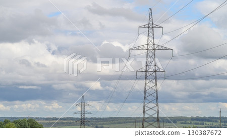 Power Lines Below a Dramatic and Beautiful Sky with Amazing Cloud Formations Above Them 130387672