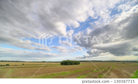 A Stunning Landscape with a Dynamic Sky That Features Beautiful Cloud Covering Above A Stunning Landscape with a Dynamic Sky That Features Beautiful Cloud Covering Above 130387715