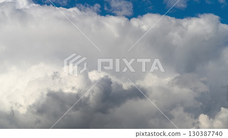 The Dynamic Cloud Formation Stands Out Beautifully Against a Bright Blue Sky Above The Dynamic Cloud Formation Stands Out Beautifully Against a Bright Blue Sky Above 130387740