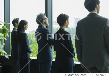 Businessman and business woman talking in the lounge Businessman and business woman talking in the lounge 130387822