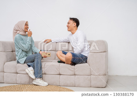 A Casual Conversation While Sitting on a Sofa Cherishing Happy Moments Between Friends A Casual Conversation While Sitting on a Sofa Cherishing Happy Moments Between Friends 130388170