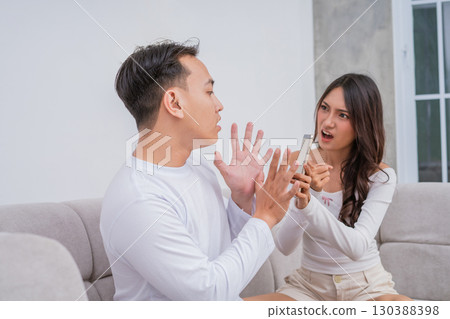 An Intense Emotional Argument Taking Place Between a Young Couple Within Their Home 130388398