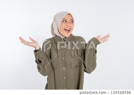 A Cheerful and Joyful Woman in a Hijab Expressing Her Emotion and Surprise 130388598