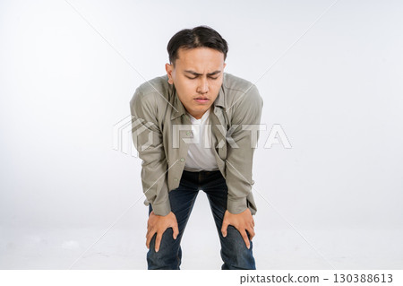 A Young Man Experiencing Significant Discomfort While in a Studio Environment A Young Man Experiencing Significant Discomfort While in a Studio Environment 130388613