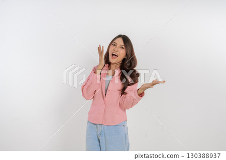 A Young Woman Conveying Her Excitement Through Casual Attire and Expression 130388937