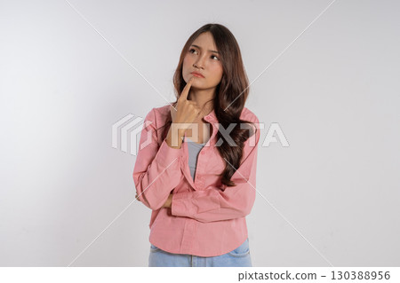 A Thoughtful Woman Engaging in Deep Pondering with Curiosity and Emotional Expression 130388956