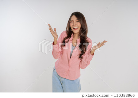 A Cheerful Young Woman is Happily Enjoying Life While Dressed in a Pink Blazer A Cheerful Young Woman is Happily Enjoying Life While Dressed in a Pink Blazer 130388966