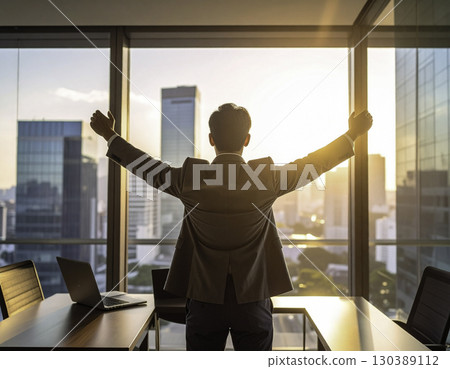 The back view of a businessman filled with a sense of accomplishment and hope 130389112