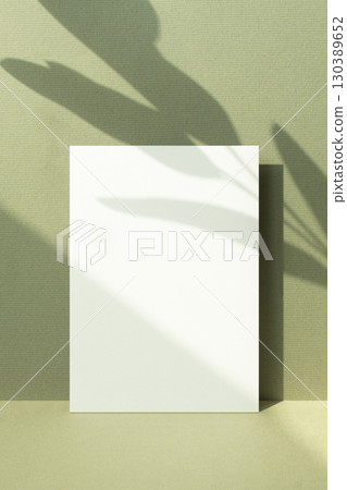 Card mockup with autumn color background and plant shadow 130389652