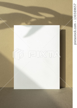 Card mockup with autumn color background and plant shadow 130389657