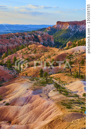 Bryce Canyon National Park Colorful Rock Formations Pine Trees and Distant Cliffs 130389785