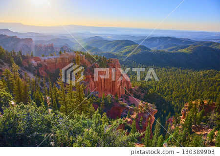 Bryce Canyon Red Rock Formations and Pine Forest Scenic Vista at Sunrise 130389903