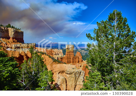 Bryce Canyon Hoodoo Formations and Pines Under Dramatic Sky in Utah 130390028