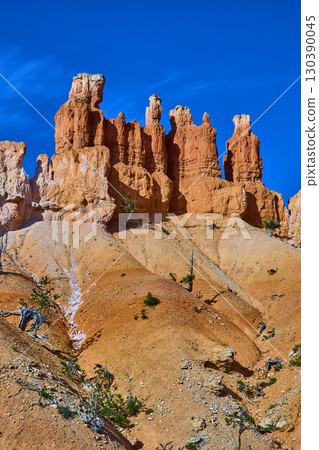 Bryce Canyon Hoodoos Rugged Red Rock Formations and Blue Sky in Utah Bryce Canyon Hoodoos Rugged Red Rock Formations and Blue Sky in Utah 130390045