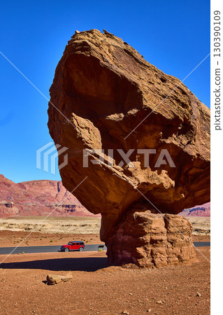Balancing Red Sandstone Boulder Adventure Vehicle Desert Landscape Low Eye Level Balancing Red Sandstone Boulder Adventure Vehicle Desert Landscape Low Eye Level 130390109