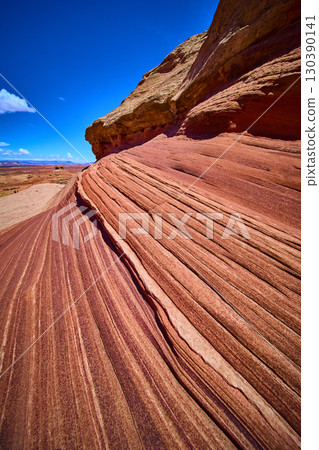 Sweeping Sandstone Striations and Desert Landscape in Motion Low Angle Sweeping Sandstone Striations and Desert Landscape in Motion Low Angle 130390141