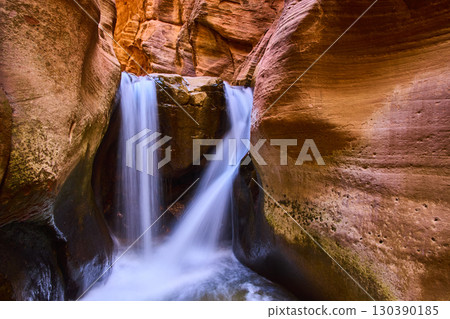 Double Waterfall Flowing Through Sandstone Slot Canyon Motion Eye Level Double Waterfall Flowing Through Sandstone Slot Canyon Motion Eye Level 130390185