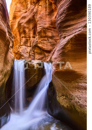 Waterfall Flowing Through Kanarra Slot Canyon Vertical Low Angle View 130390189
