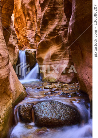 Sandstone Slot Canyon Waterfall Motion and River Rocks Eye Level Perspective 130390207