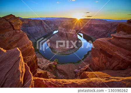 Horseshoe Bend Colorado River and Sunlit Sandstone Cliffs at Sunset Overlook Horseshoe Bend Colorado River and Sunlit Sandstone Cliffs at Sunset Overlook 130390262