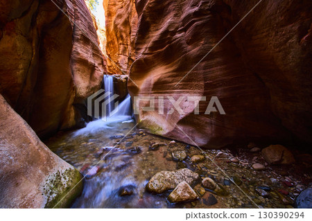 Slot Canyon Waterfall Motion and Sandstone Walls Eye Level Perspective Slot Canyon Waterfall Motion and Sandstone Walls Eye Level Perspective 130390294